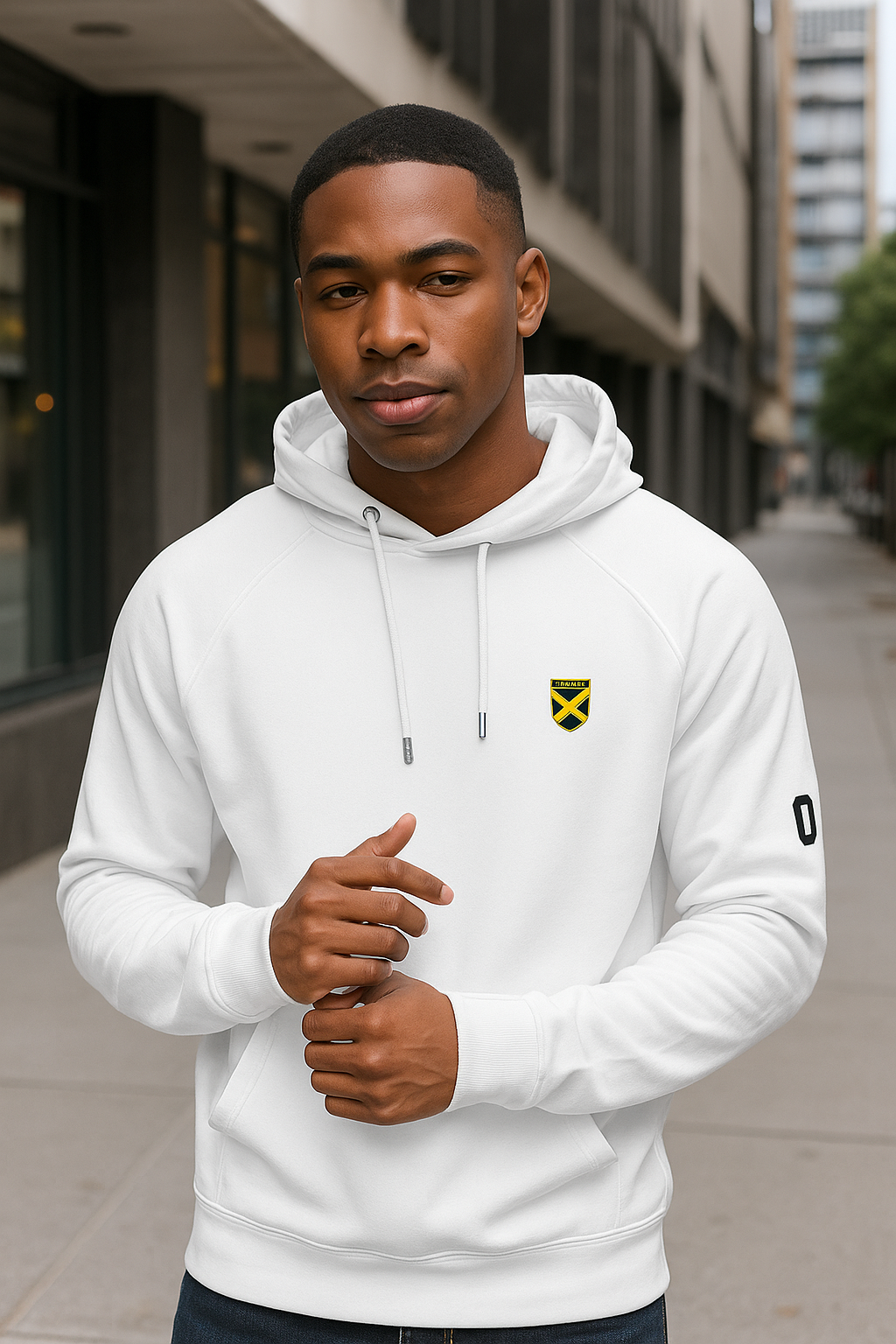 Man wearing a white hoodie with a logo on a city street